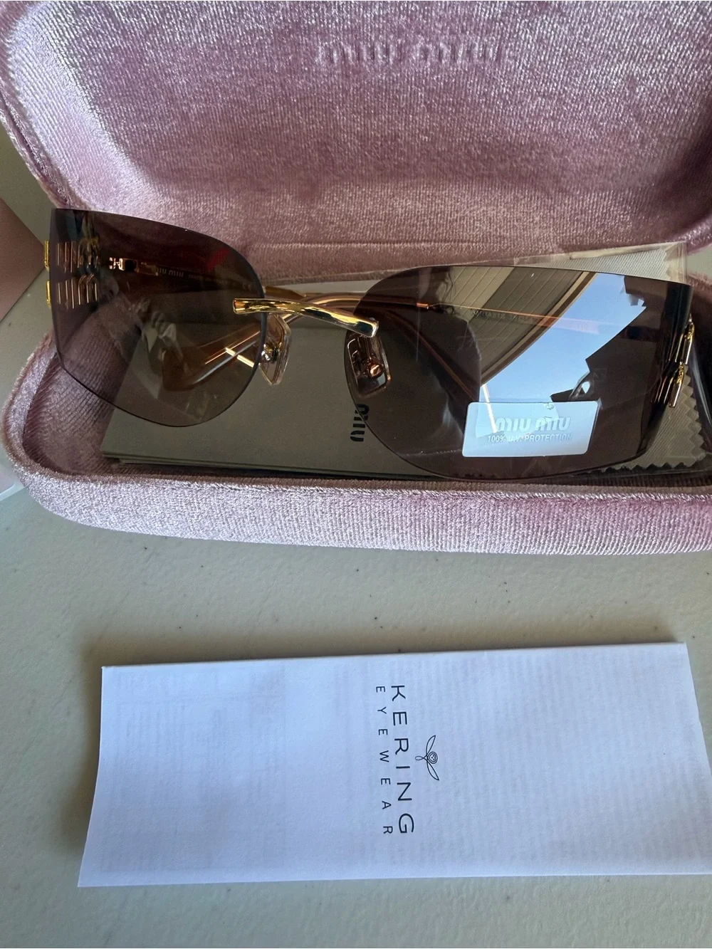 Miu Miu Women's Rimless Sunglasses in Brown